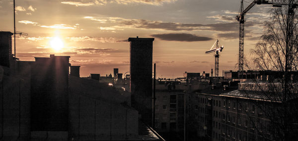 Cityscape against sky during sunset