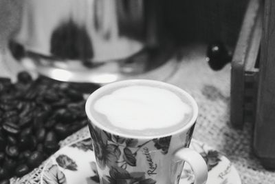 Close-up of hand holding coffee cup