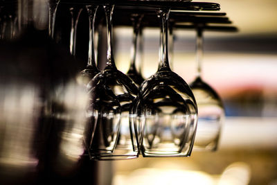 Close-up of upside down hanging wineglasses