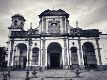 Facade of historic building against sky