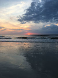 Scenic view of sea against cloudy sky