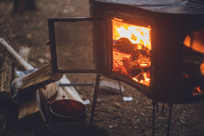 Close-up of bonfire on wooden log