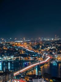 High angle view of illuminated city buildings at night