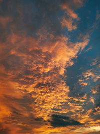 Low angle view of dramatic sky during sunset