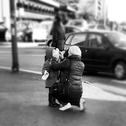 Woman looking at city street