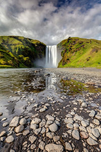 Reflection of skogafoss waterfall in the south of iceland