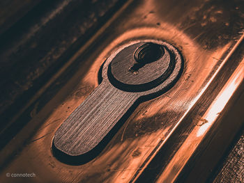 High angle view of old machine on wooden table