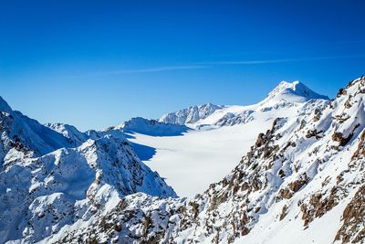 Scenic view of snow covered mountains