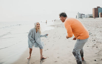 Rear view of people on beach