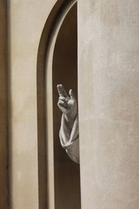 Statue of buddha against wall