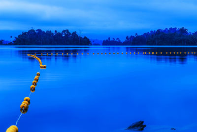 Scenic view of lake against blue sky