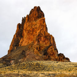 Low angle view of rock formations against sky