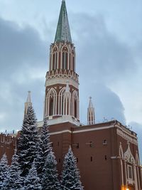 Low angle view of building against sky during winter