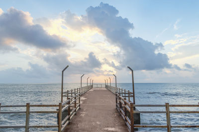 Pier over sea against sky