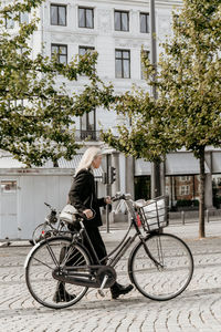 Woman walking with her bicycle