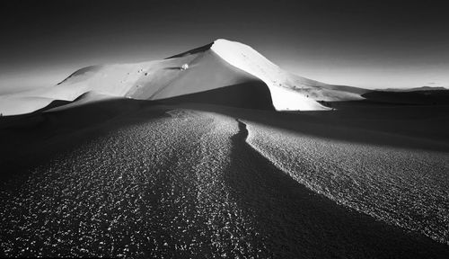 Scenic view of desert against sky