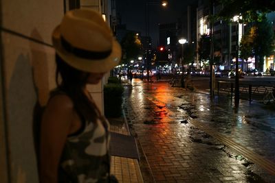 Man in city at night