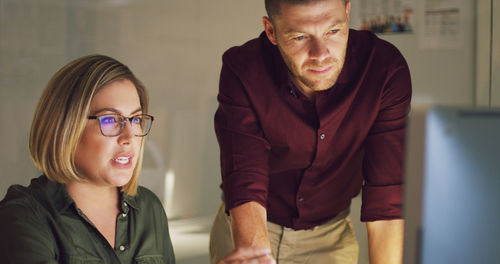 Businessman with colleague brainstorming at office