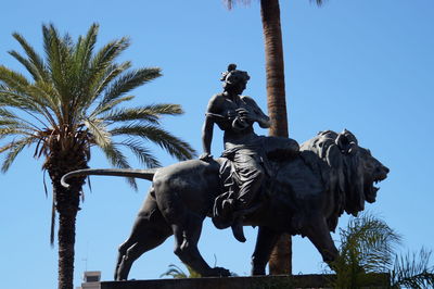 Low angle view of statue against sky