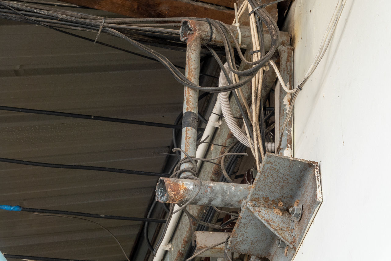 HIGH ANGLE VIEW OF OLD MACHINE PART OF ABANDONED BUILDING