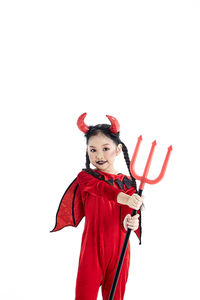 Portrait of woman with red umbrella against white background