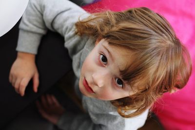 Directly above portrait of girl at home