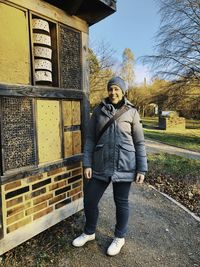 Full length portrait of smiling standing in park