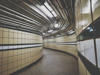 Illuminated tunnel at subway station