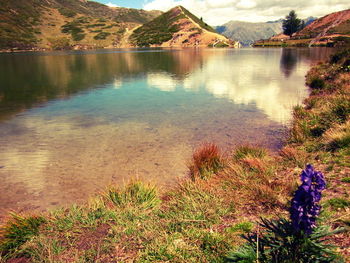 Scenic view of lake with mountains in background