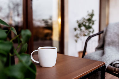 Close-up of coffee cup on table