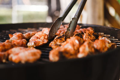 Close-up of meat on barbecue grill