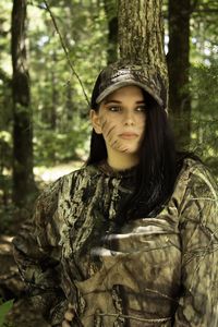 Portrait of young woman in forest