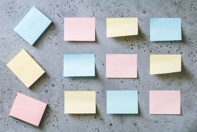Close-up of sticky notes on wall