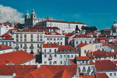 Buildings in city against sky