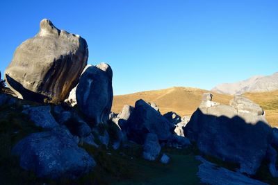 Rock formations against blue sky