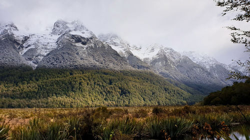 Scenic view of snowcapped mountains against sky