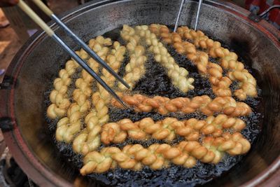 Close-up of meat in cooking pan