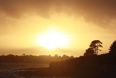 Scenic view of silhouette mountains against sky during sunset