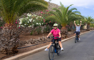 People riding bicycle on road