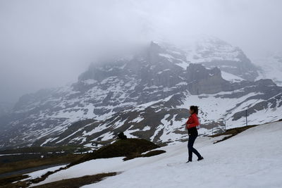 Full length of person on snowcapped mountains during winter