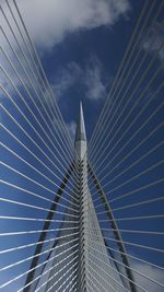 Low angle view of suspension bridge against sky