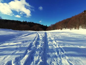 Scenic view of snow covered mountains against sky