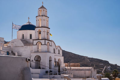 The church of christ - blue dome and bell tower - pyrgos village, santorini island, greece