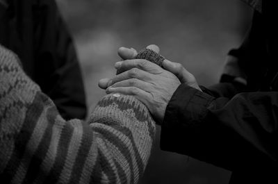 Close-up of couple holding hands