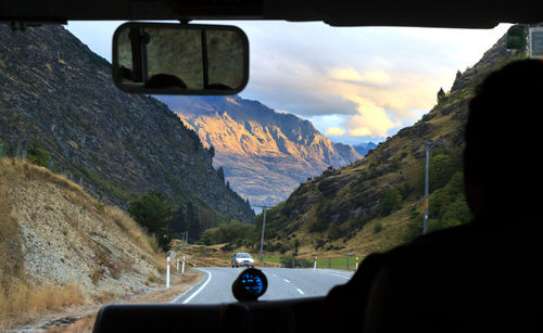 Car on road against mountain range
