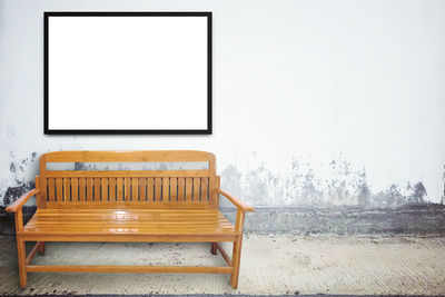 Empty chairs against wall