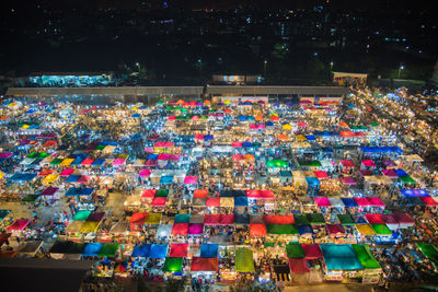 High angle view of illuminated colorful markets at night