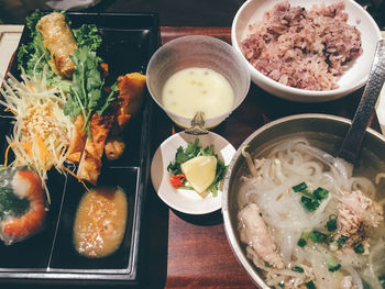 High angle view of various food served on table