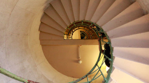 Directly below shot of spiral staircase of building