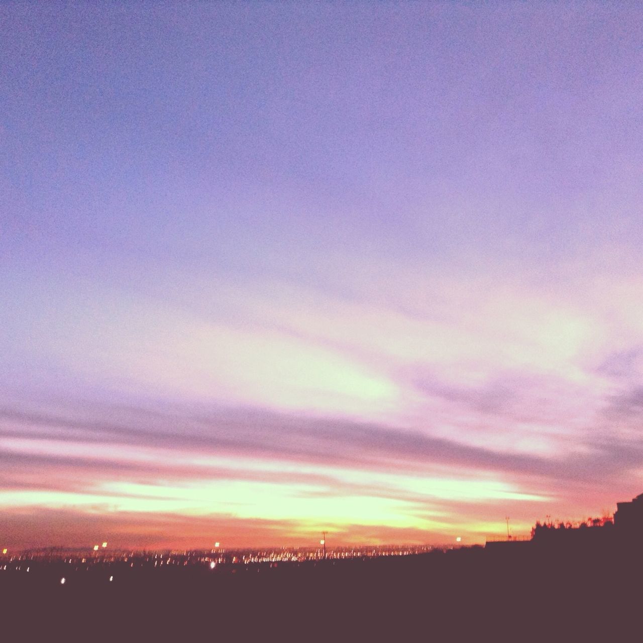 sunset, silhouette, sky, scenics, beauty in nature, tranquil scene, tranquility, landscape, nature, cloud - sky, orange color, idyllic, dusk, dramatic sky, outdoors, copy space, cloud, built structure, no people, dark